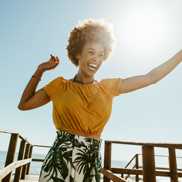 young woman dancing and laughing
